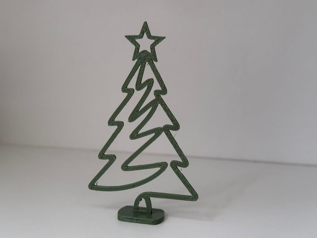 Minimalistisk julgransfigur med stjärna och fot