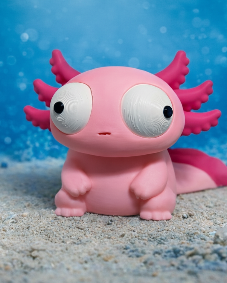 Tokig axolotlfigur med stora rörliga ögon, framifrån