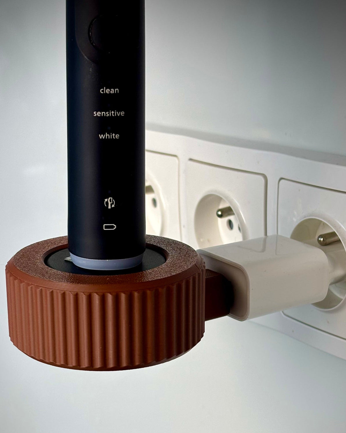 Hållare för Philips Sonicare-laddare med kabelvinda
