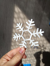 Set med 4 underlägg formade som snöflingor