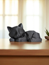 Detalj av geometriska former på skulptur av sovande kattunge
