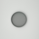 Närbild av den runda nyckelbrickans minimalistiska form
