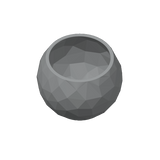 Närbild av en low poly-skål med fasetter inspirerade av sprucken sten och skuggspel