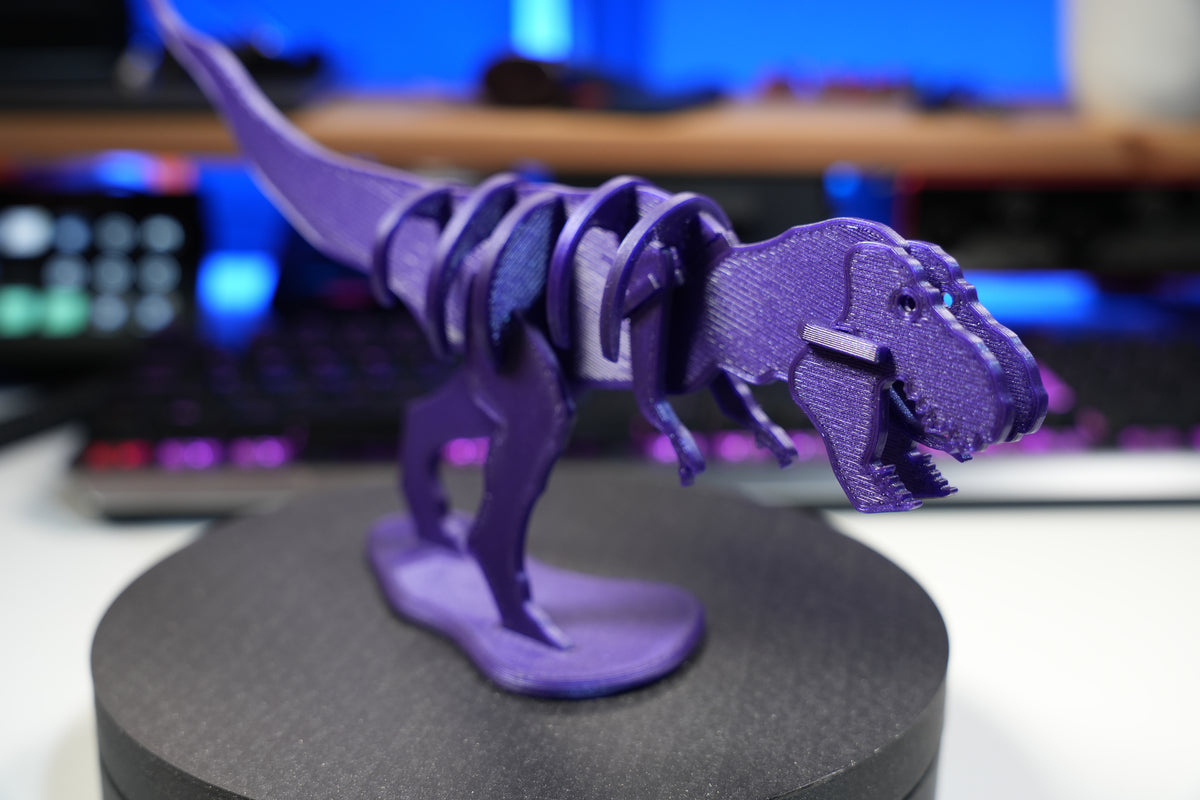 T-Rex-leksaksdinosaurie att skjuta ihop