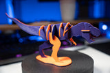 T-Rex-leksaksdinosaurie att skjuta ihop