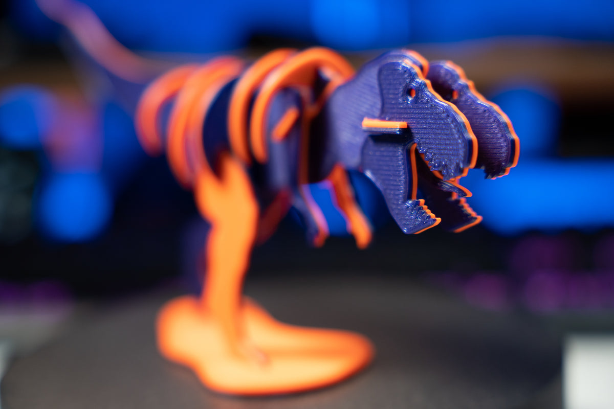 T-Rex-leksaksdinosaurie att skjuta ihop