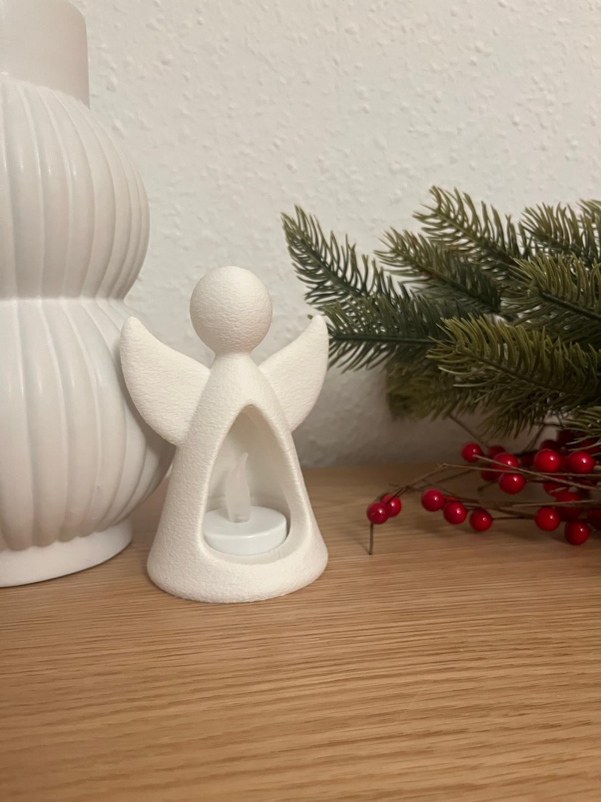 Ängelfigur med LED-värmeljus som lyser inifrån