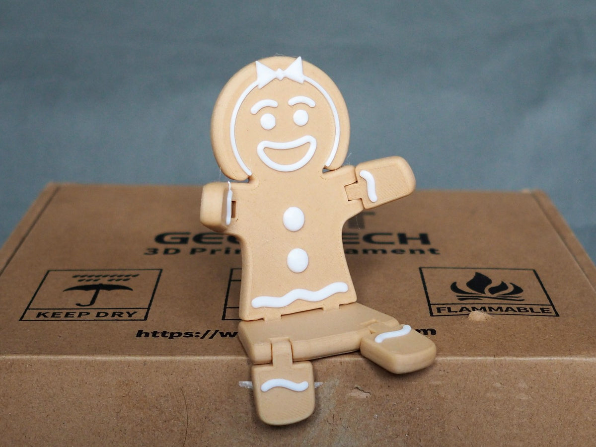 Pepparkaksgumma till jul i brunt och vitt