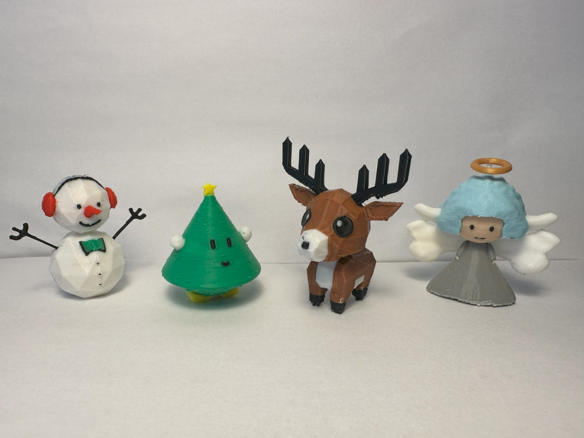 Julfigurset med snögubbe, julgran, ren och ängel