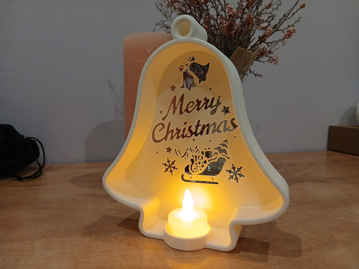 Julklocka med utskärningar och LED-värmeljus