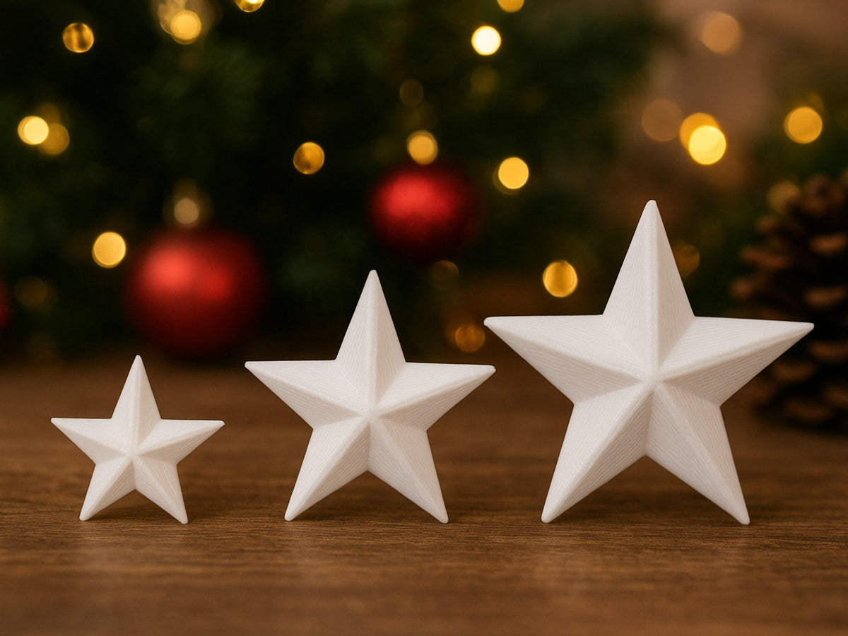 Tre julstjärnor i storlekarna 3, 4 och 5 cm
