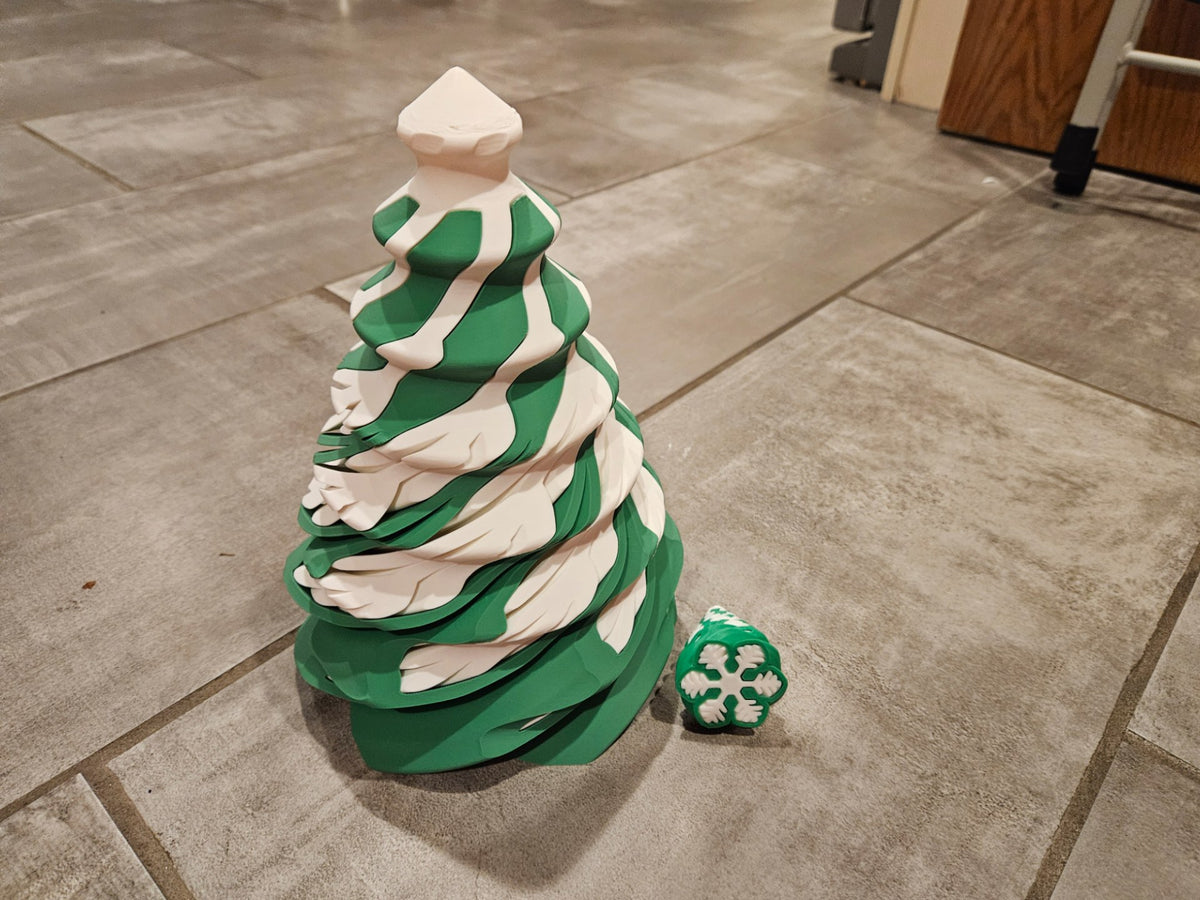 Spiralformad julgransfidget formad som snöflinga och julgran