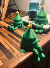 Liten grön julgransfigur med gul stjärna