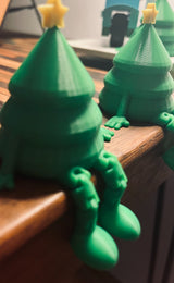 Liten grön julgransfigur med gul stjärna