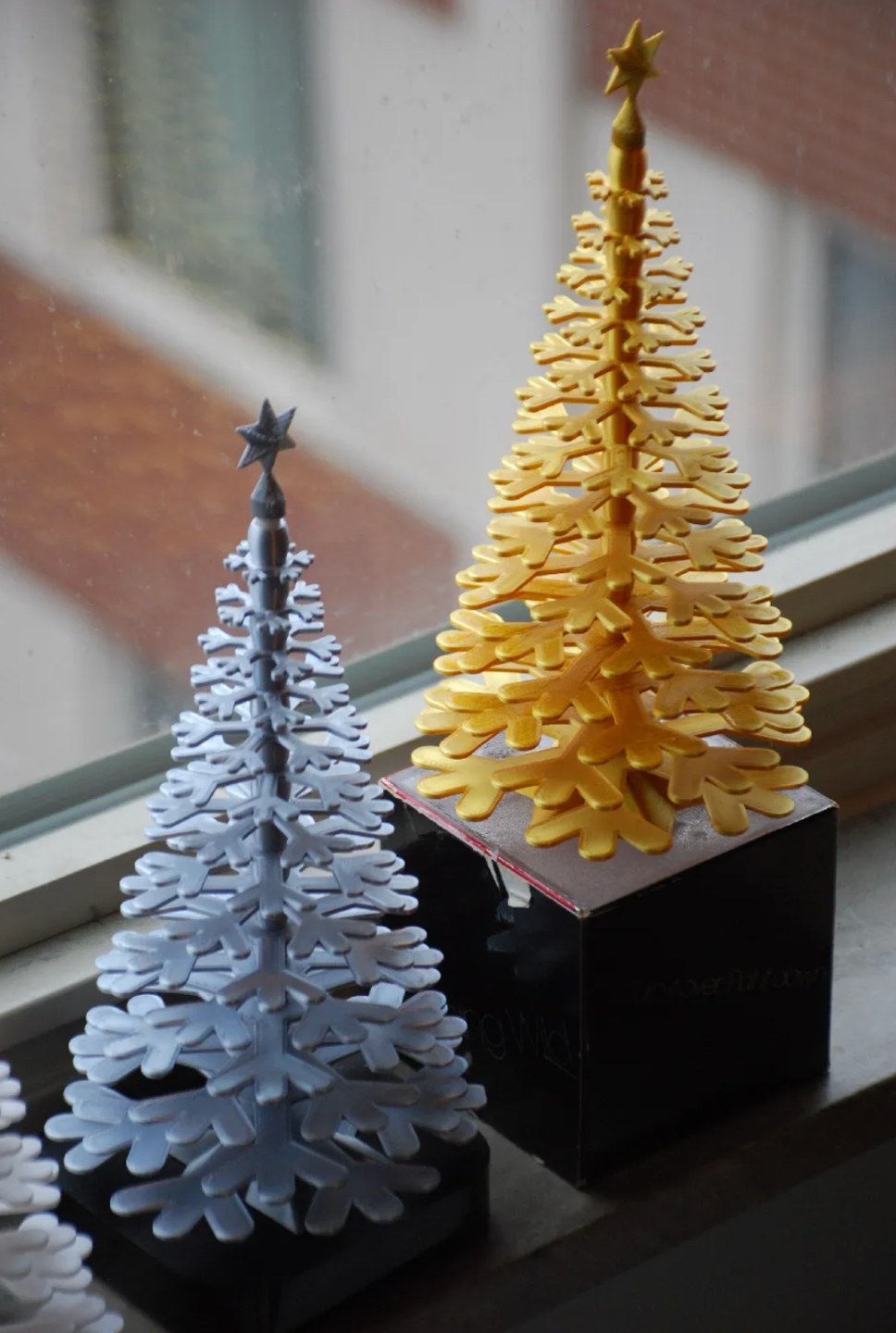Julgransfigur av snöflingor med stjärna