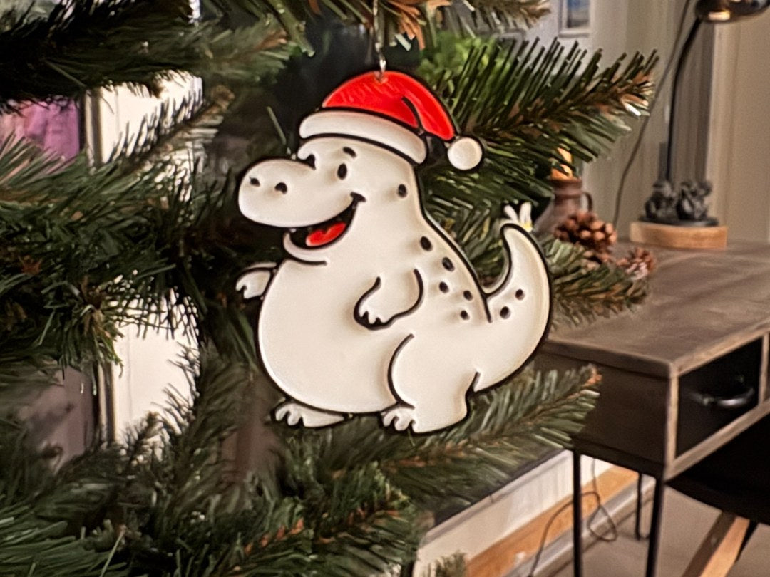 Liten dinosaurie som julgransprydnad