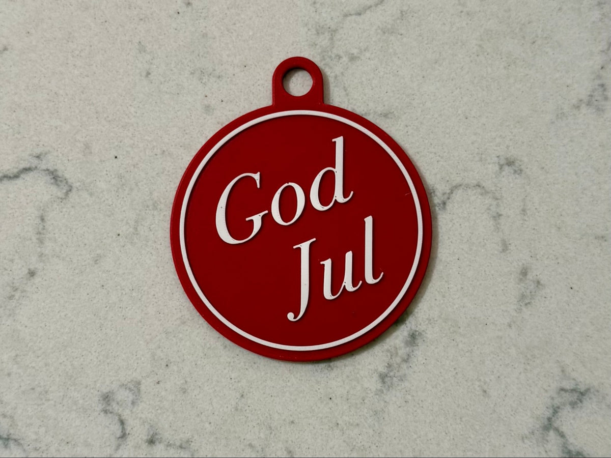 Elegant julgransprydnad med texten God Jul