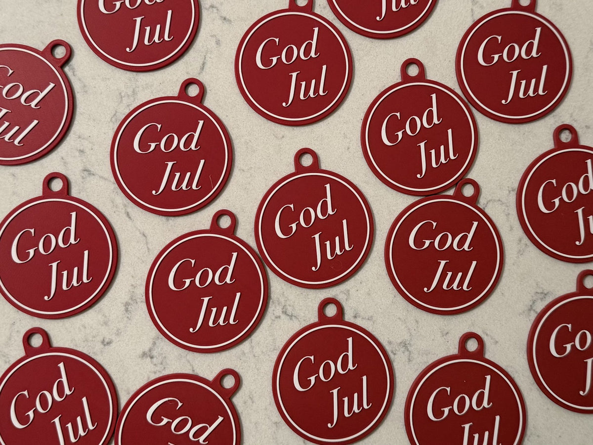 Elegant julgransprydnad med texten God Jul