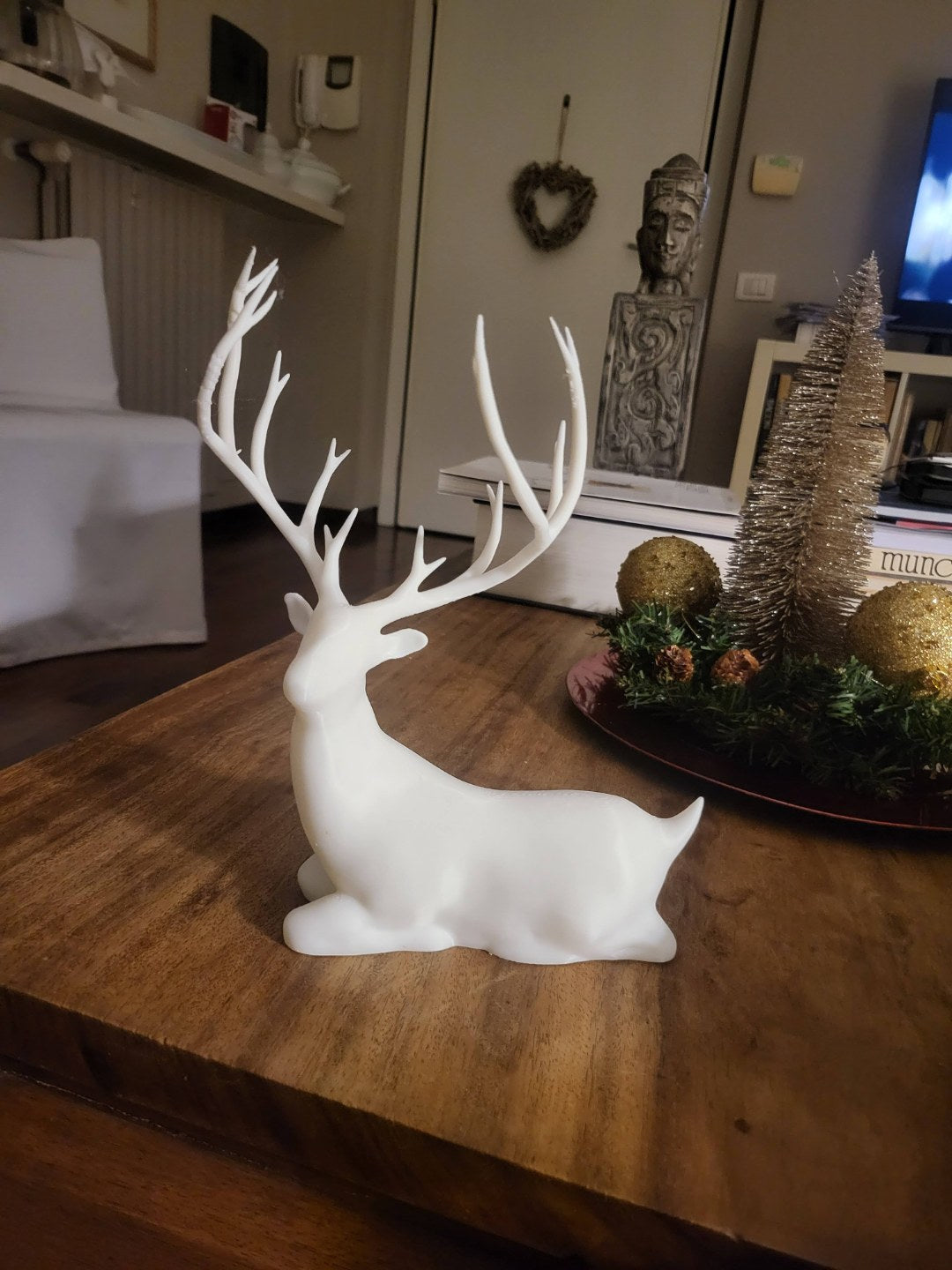 Sittande renfigur, julpynt