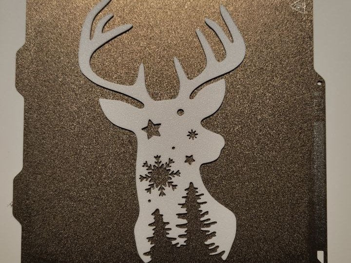 Rensiluett med stjärnor och julgranar