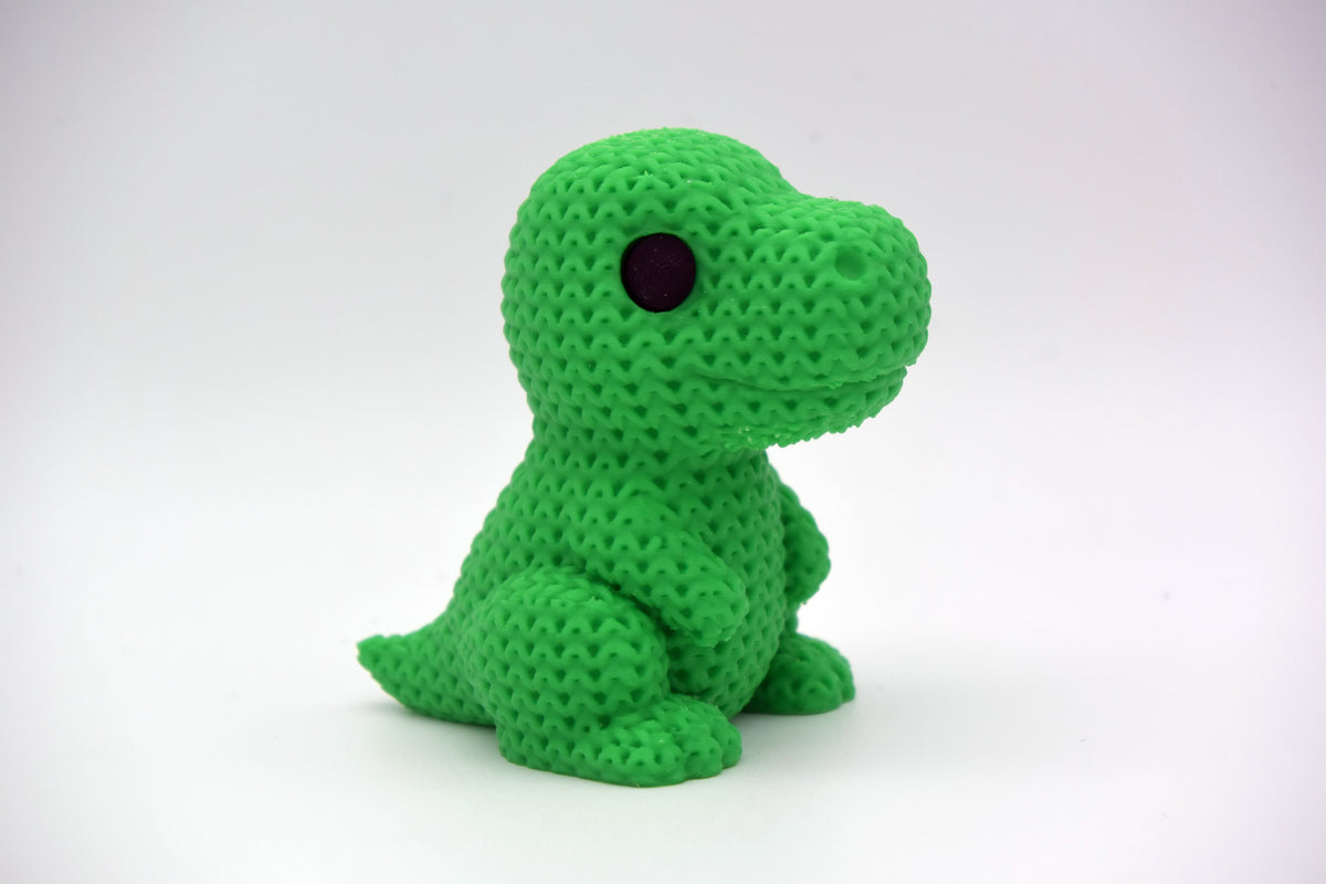 Detalj av virkad struktur på T-rex-dinosauriefigur