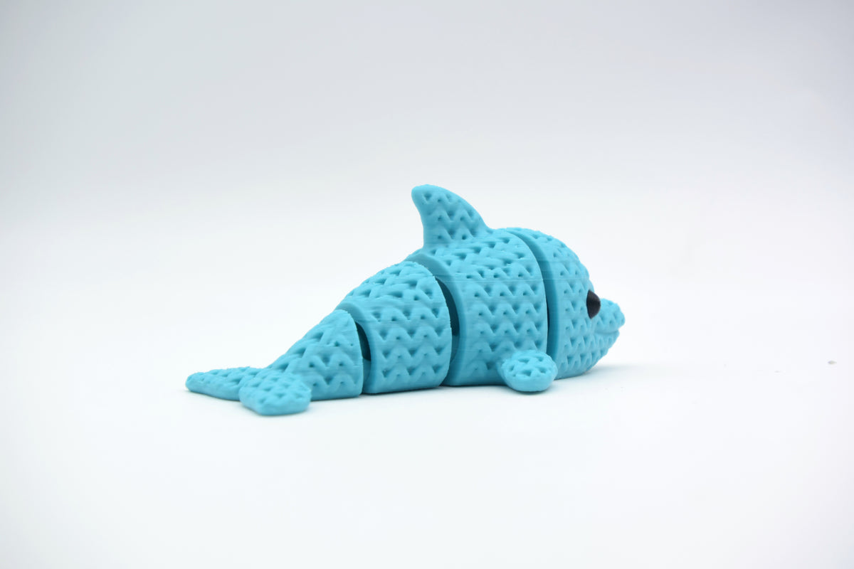 Strukturdetalj av en stickad delfin med vävd yta och ledad, flexibel kropp