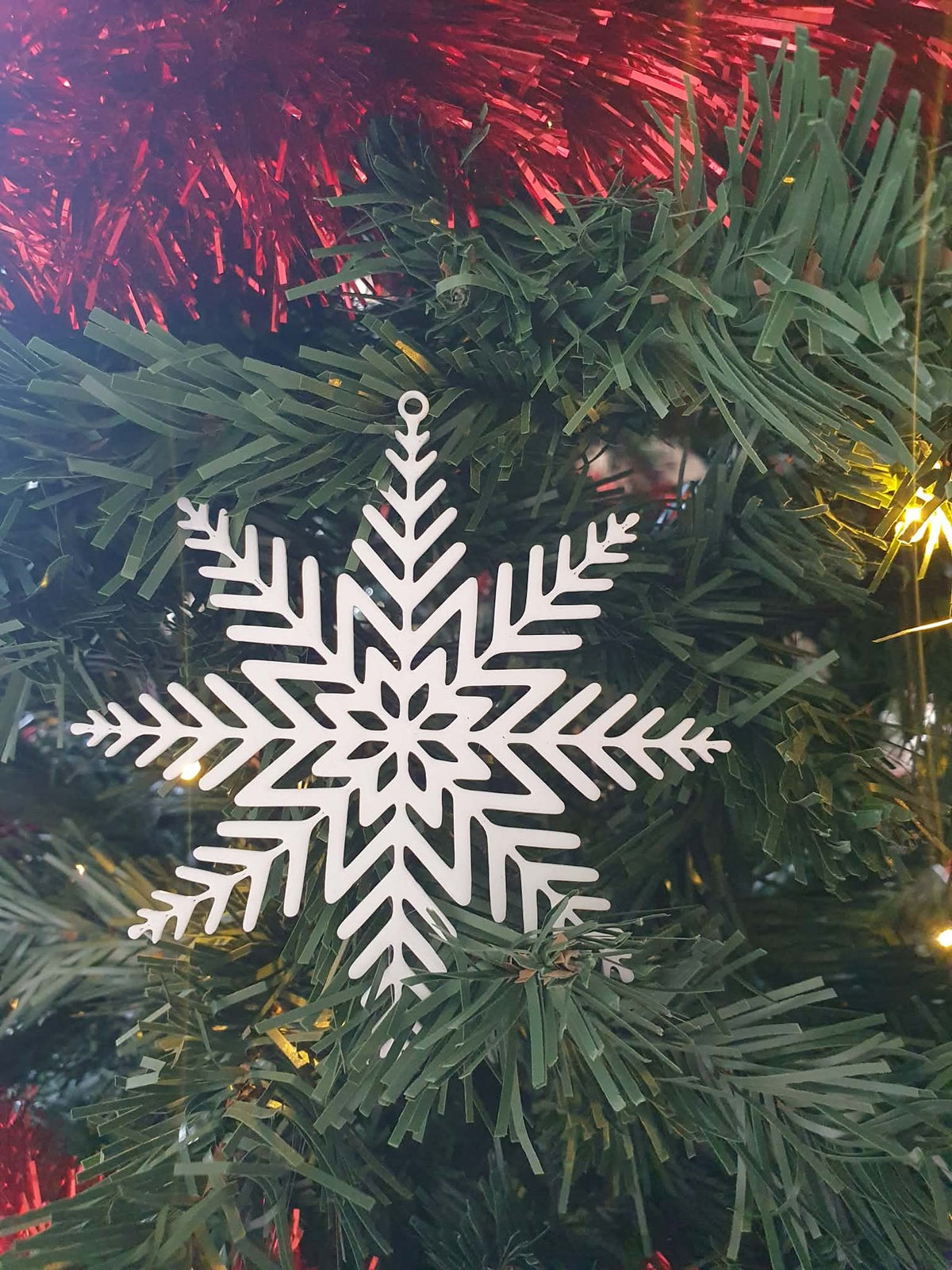 Snöflinga som julgransprydnad