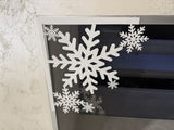 Snöflinga som juldekoration till dörr och fönster