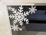 Snöflinga som juldekoration till dörr och fönster