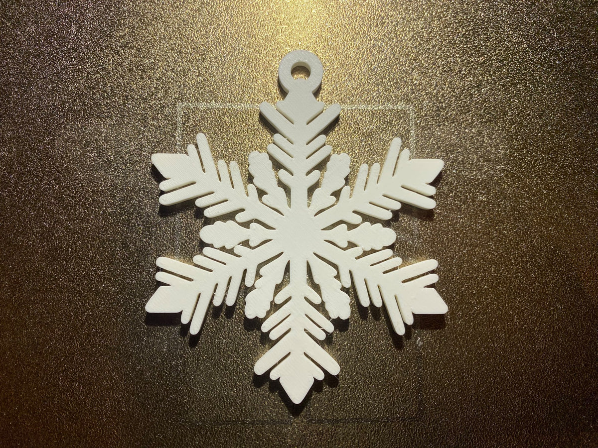 Snöflinga med sex armar och upphängningsögla
