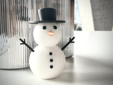 Snögubbsfigur i flera färger – juldekoration