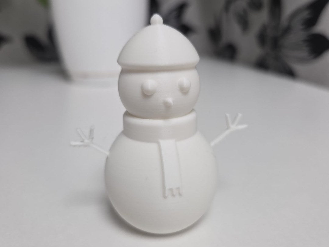 Minimalistisk snögubbsfigur med leende
