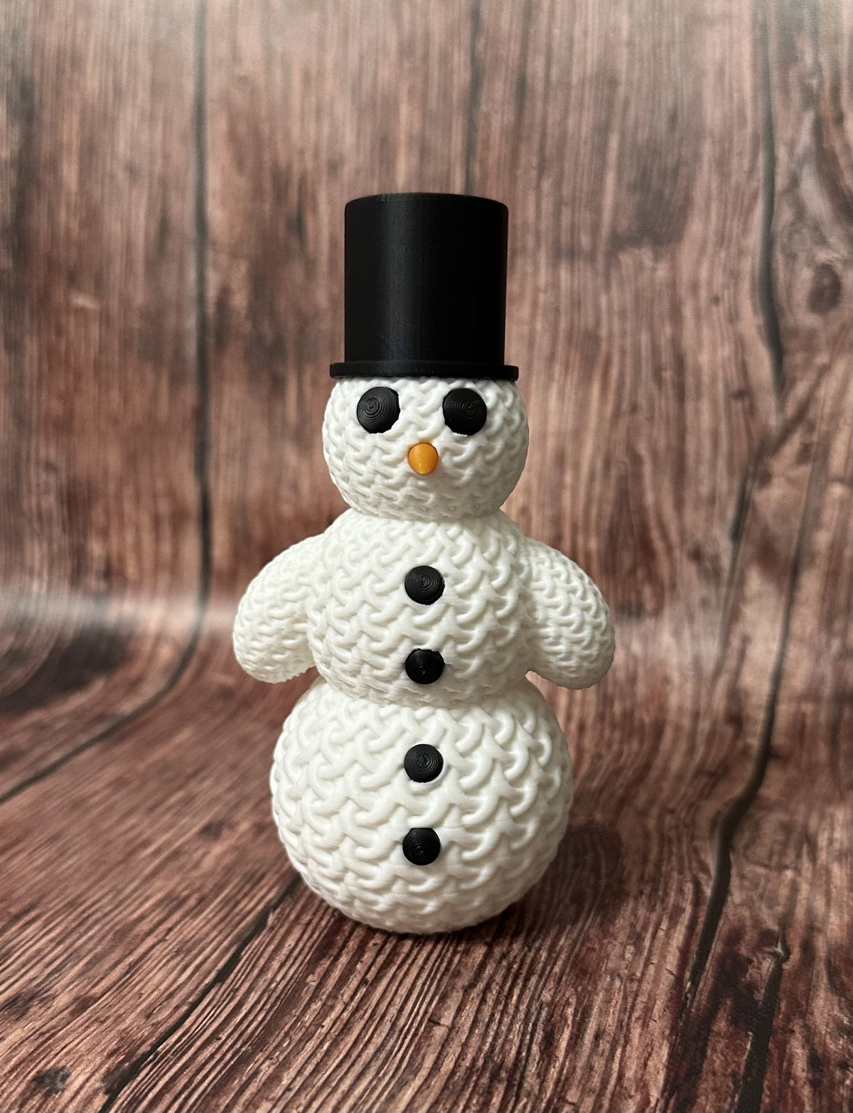 Söt stickad snögubbe med hatt