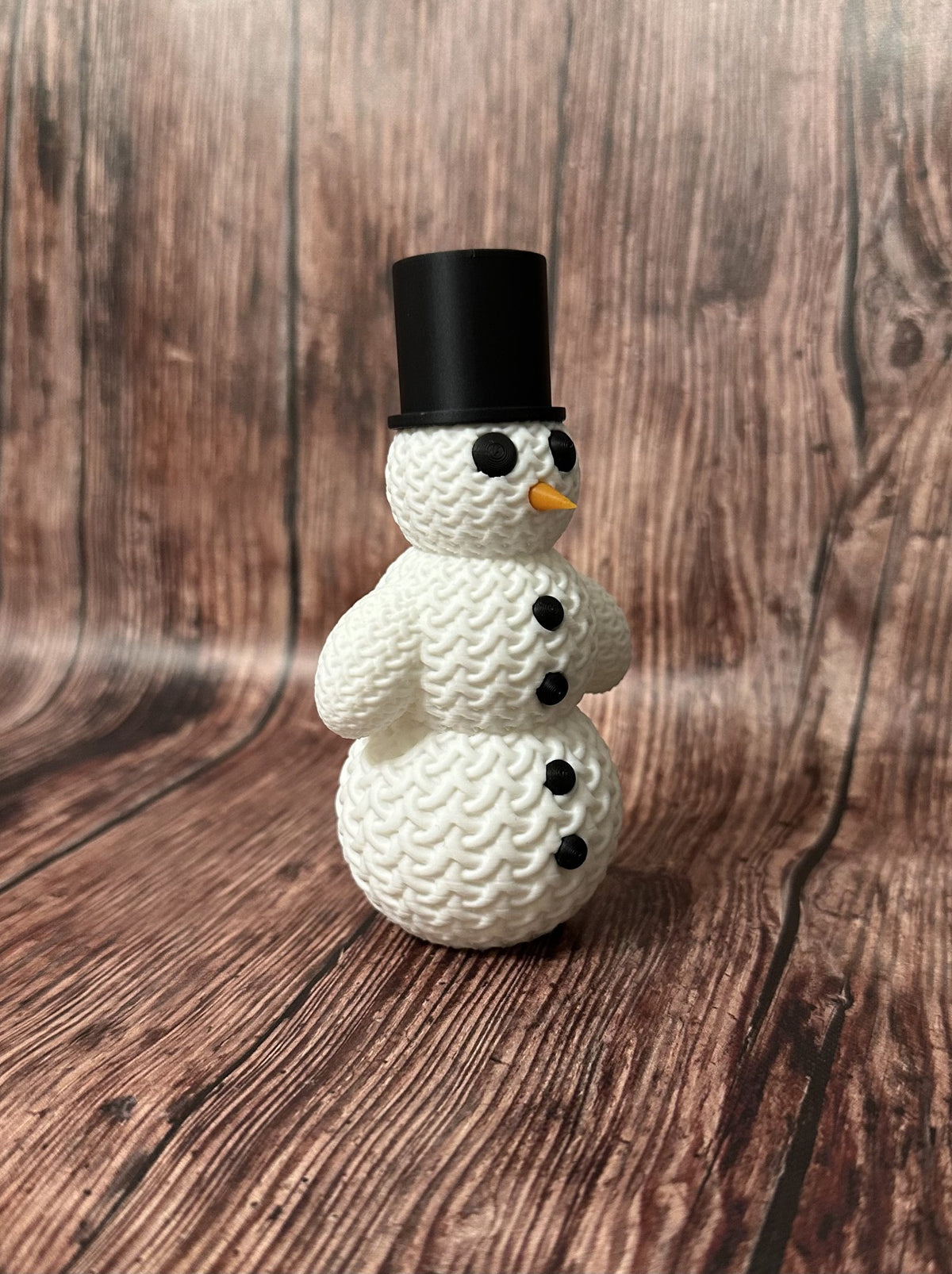 Söt stickad snögubbe med hatt
