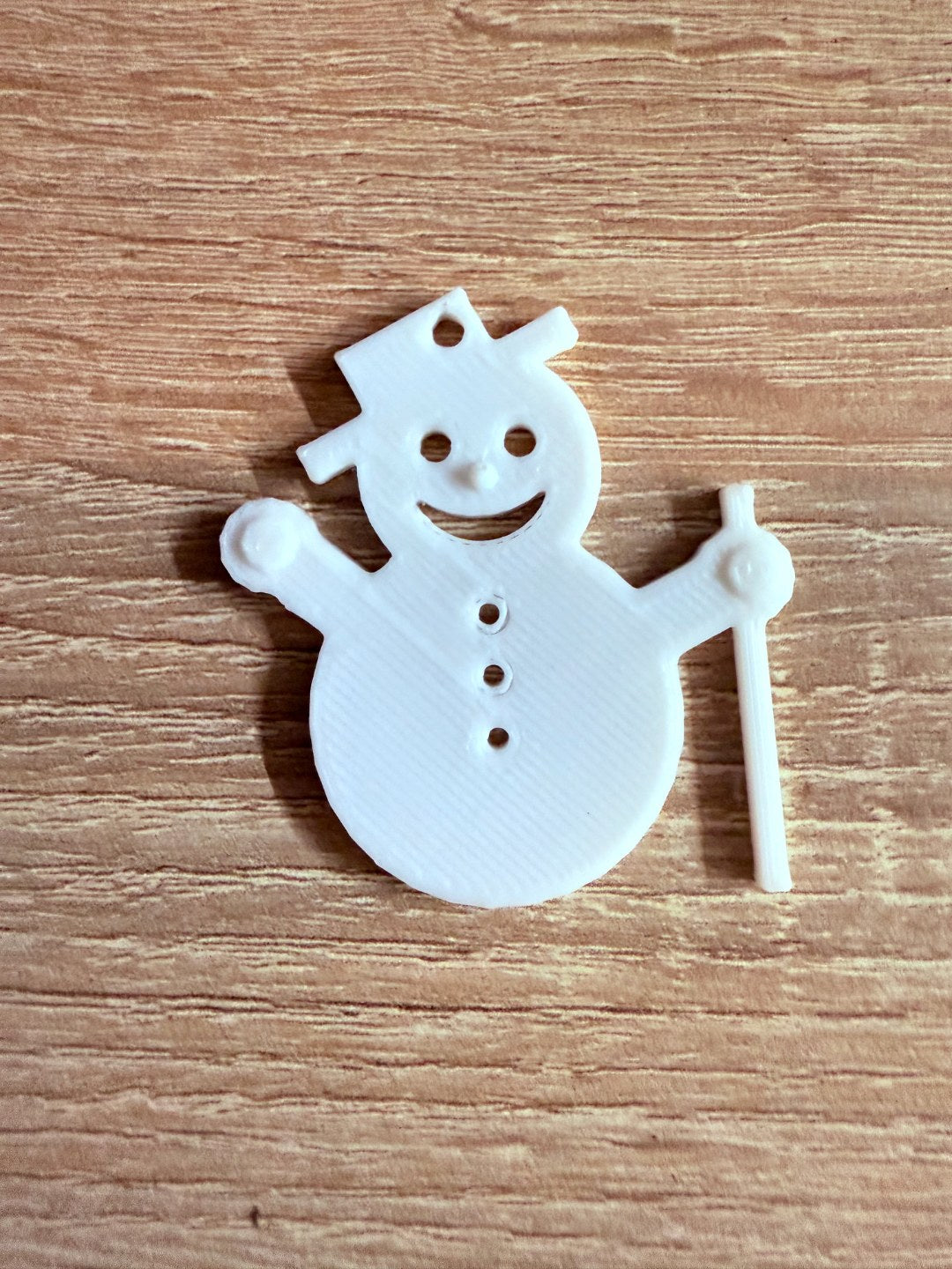 Minimalistisk snögubbe som julgransprydnad