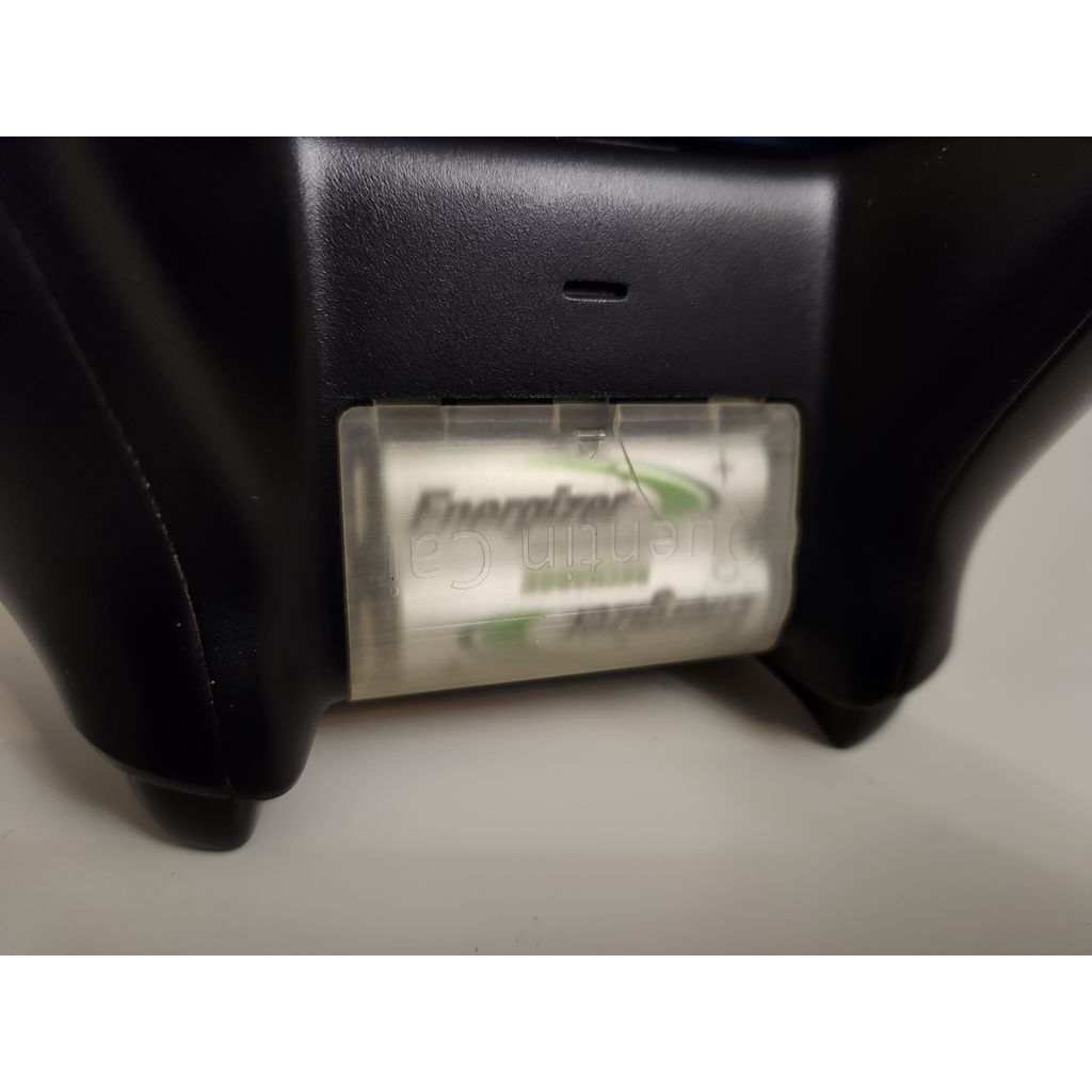 Batterilucka till Xbox med logga och utmatningssymbol