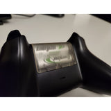 Batterilucka till Xbox med logga och utmatningssymbol